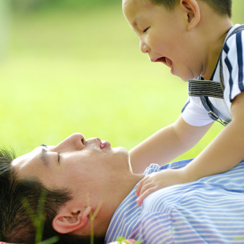 Dad playing with his son.